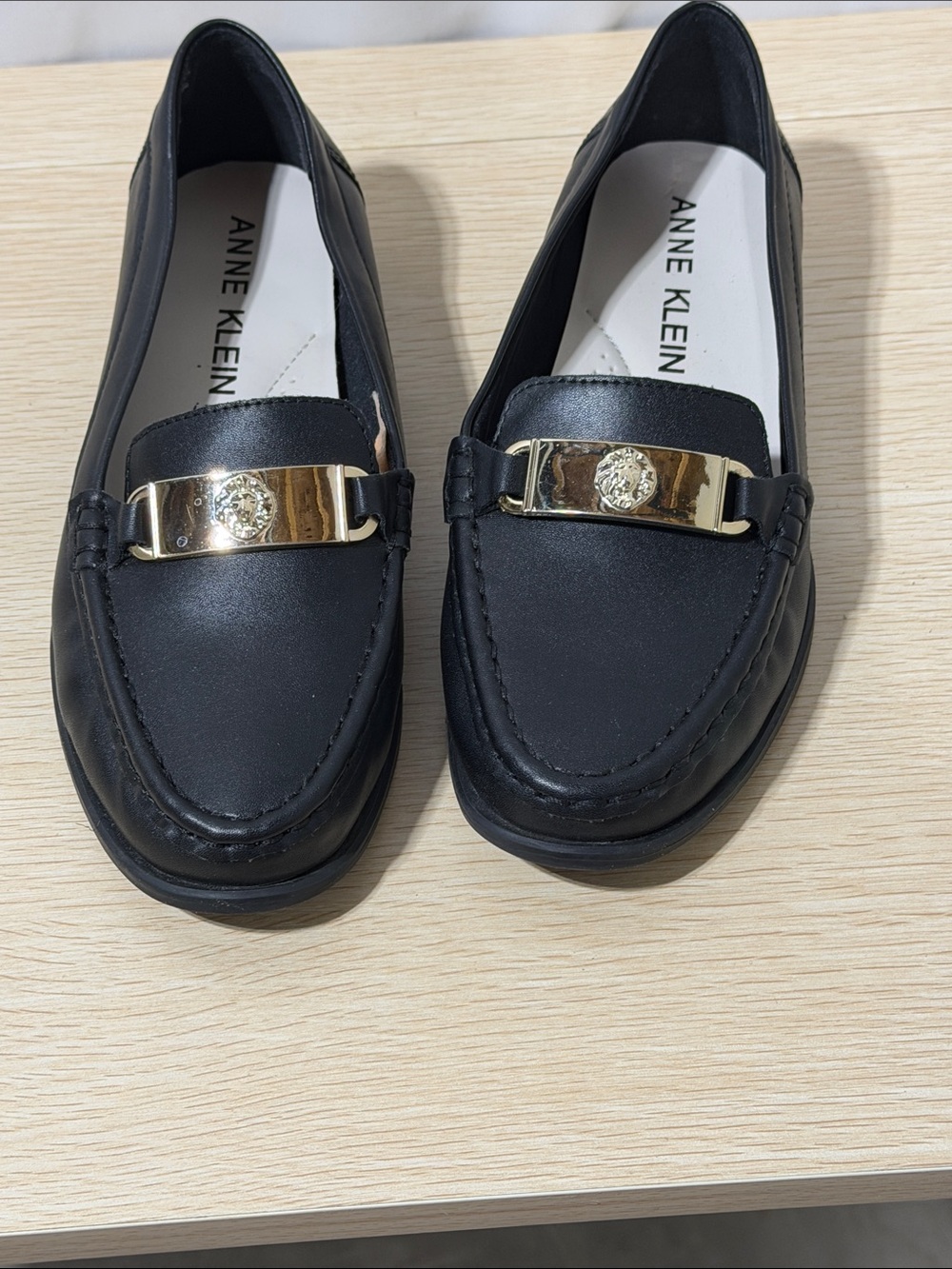 Anne Klein Black Slip-On Loafers with Gold Bar Detail